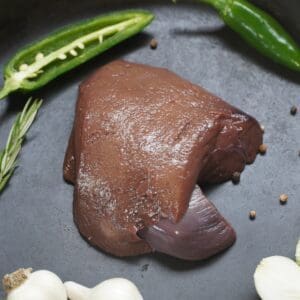 A piece of meat is sitting on the pan.