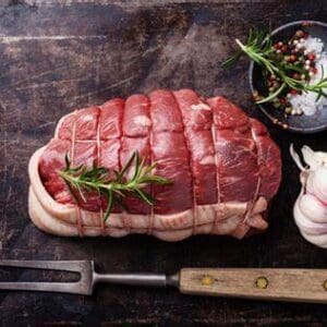 A raw meat sitting on top of a table.