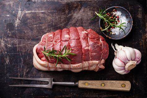 A raw meat sitting on top of a table.