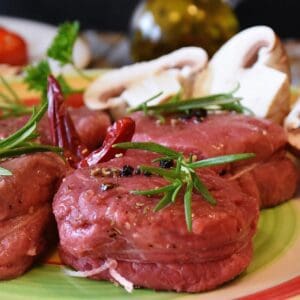 A plate of food with meat and vegetables on it.
