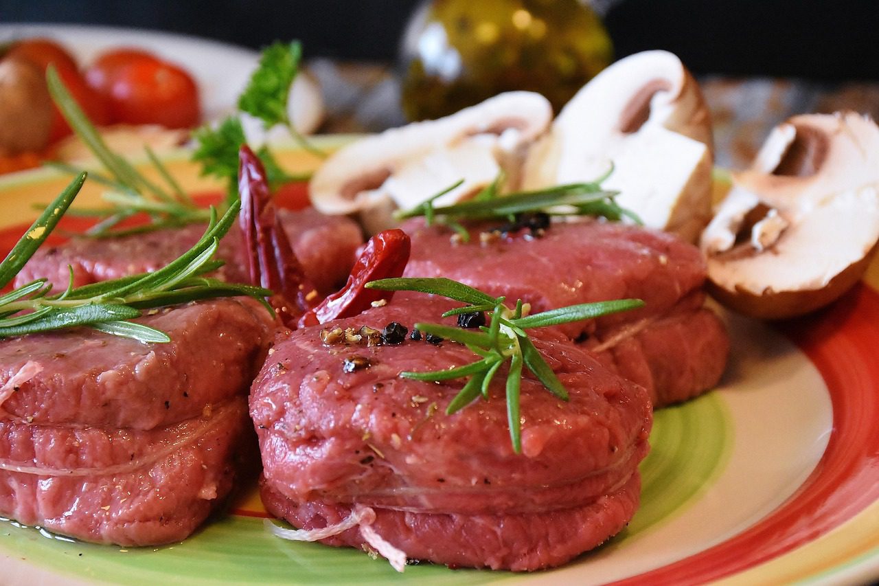 A plate of food with meat and vegetables on it.