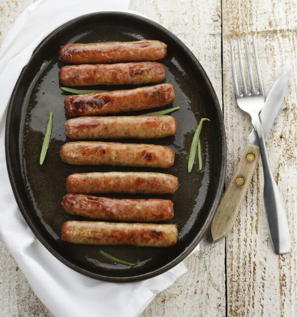 A pan of sausage on top of a table.