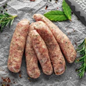 A bunch of sausages sitting on top of a table.