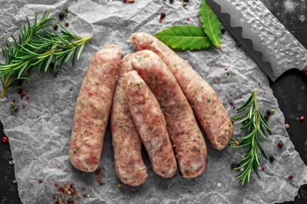 A bunch of sausages sitting on top of a table.