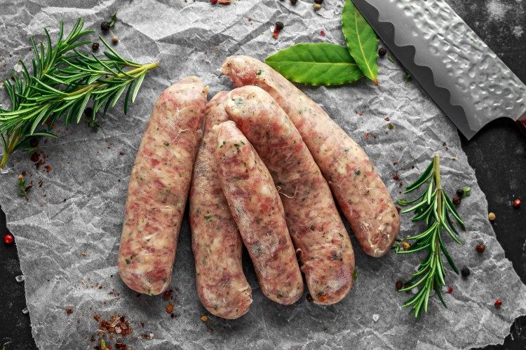 A bunch of sausages sitting on top of a table.
